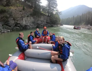 Backroads guests smiling on raft 