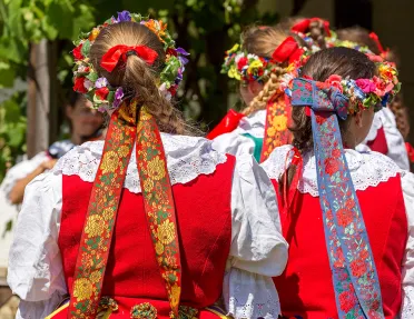 Women with German braids and ribbons in hair.