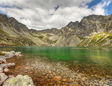 Lake bordered by mountains.