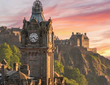 clocktower against a pink sunset