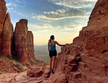 Guest on red-rock clifftop, overlooking Utah valley.