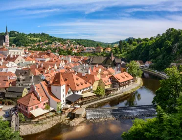 Aerial view of a city in Austria with red roofs.