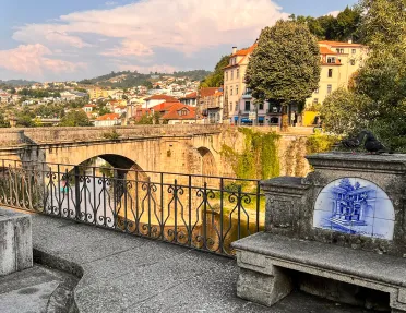 Bridge leading to a rustic town