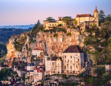 stone buildings along cliffside