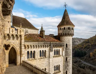 stone castle with mountains in the background