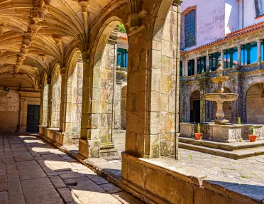 Ancient building courtyard with pillars and a fountain