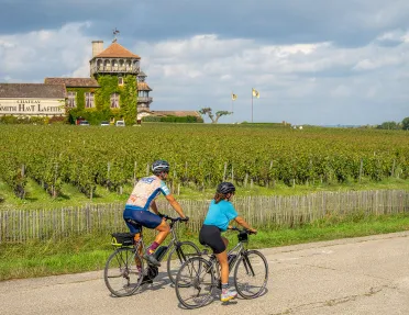 backroads guests biking through vineyard