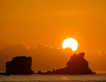 Sun rising over the water