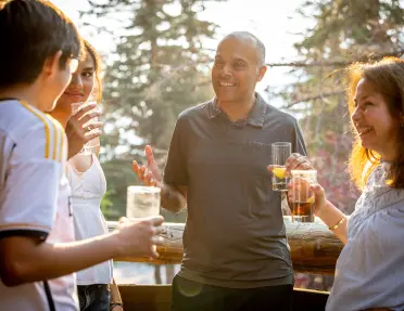 guests talk to each other while having cocktails