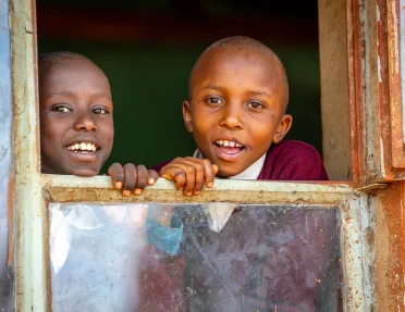 children looking out a window