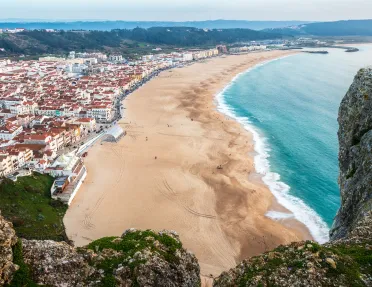 sandy beach with houses on the shore