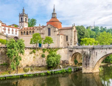 old stone buildings next to a river