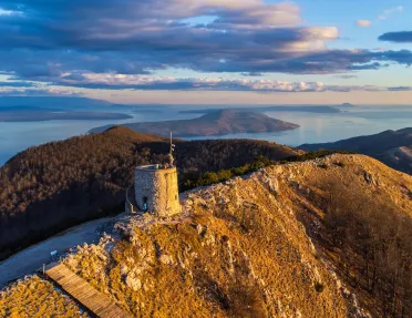 stone watchtower on a mountain peak