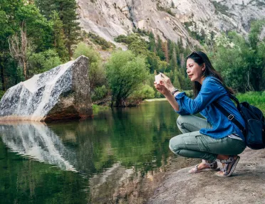 A hiker stops to take a photo