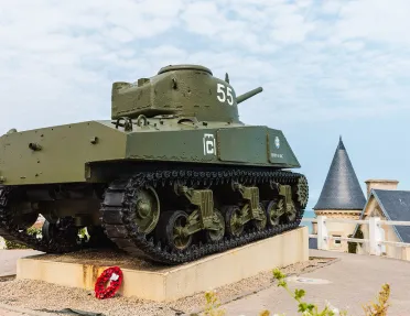 Dark green tank on the roof of a building