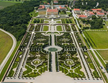 Sky view of a large outdoor garden leasing to a large building complex
