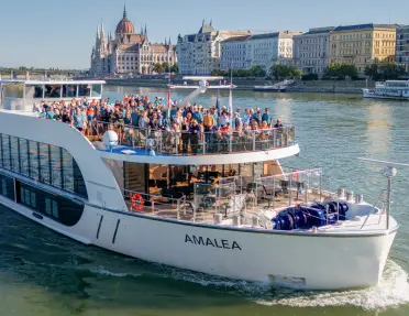 Giant boat with a large group of people on top, smiling