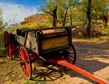 Rustic black and red wagon with a trailer hitch