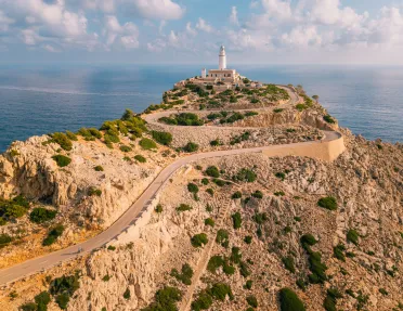 Long road along a cliff, leading to a lighthouse