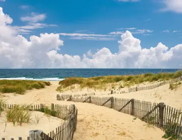 Small pathway of sand leading to the beach