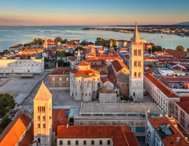 Sky view of town with the ocean in the background