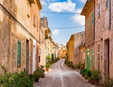 Stone alleyway with stone buildings on either side