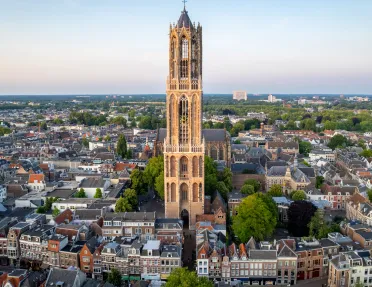 Large church bell tower in the center of a town