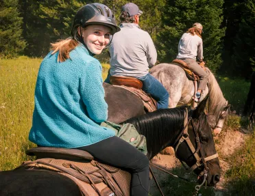 Backroads guests on a horseback ride