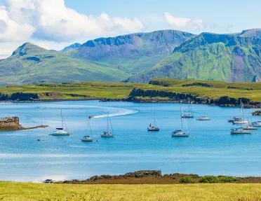 Multiple boats floating in a large lake