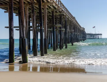 Under-bridge view of an ocean shore