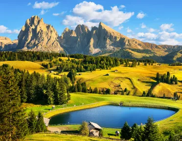 Large grassy valley with a lake in the center