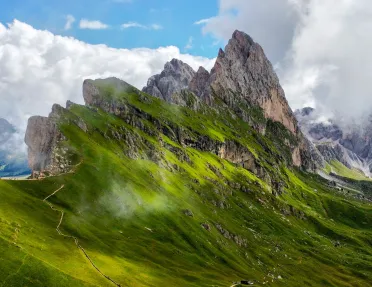 Steep mountain peaks covered in grass