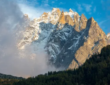 Snowy mountain covered in fog