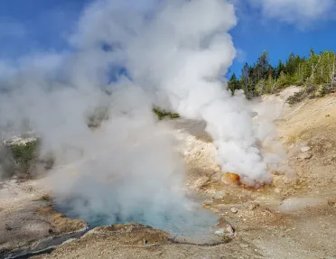Active geyser with steam coming from the ground
