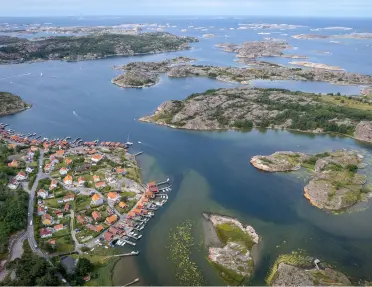 Sky view of a coastal town with small islands in the water