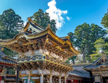 Intricate wood carvings and gold leaf details at the Nikko Toshogu Shrine in Nikko city, Japan.