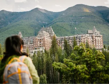 A women overlooking the Fairmont Banff Springs hotel in Alberta, Canada.