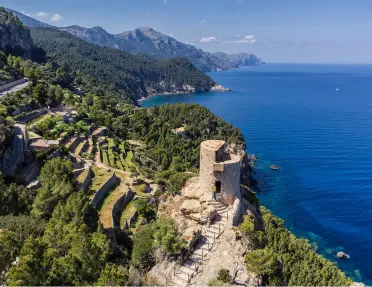 Sky view of ocean coast with ruins of stone buildings