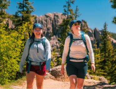 Guests hiking on a trail in South Dakota