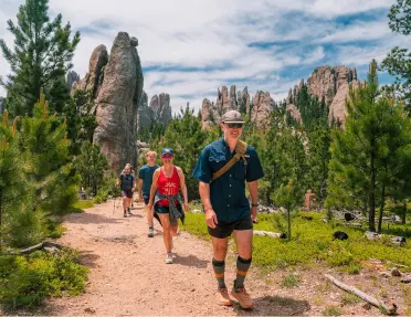 Guests being led by a Backroad's trip leader on a trail through South Dakota