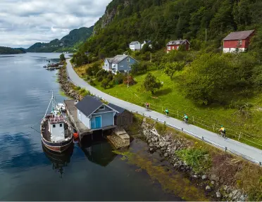 Lake shore with a boat docked by a hut