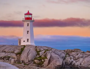 A lighthouse on rocky cliff in Nova Scotia