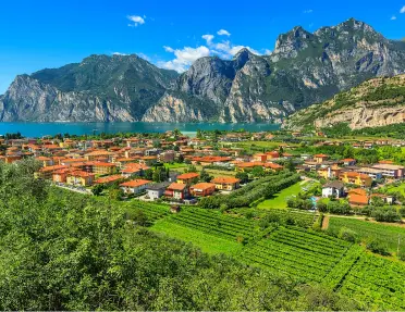 Sky view of large valley and a town, next to the ocean