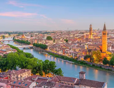 Sky view of town during a sunset, with a river in the center