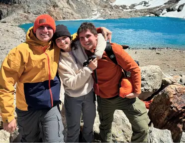 A happy, smiling family at Torres del Paine National Park, located in Chile's Patagonia region.   