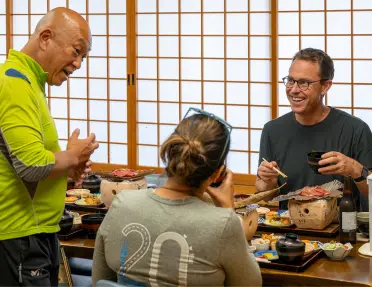 Man and woman eating in a traditional, Japanese room