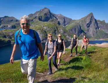 A family on a hike in Norway's Lofoten Islands.