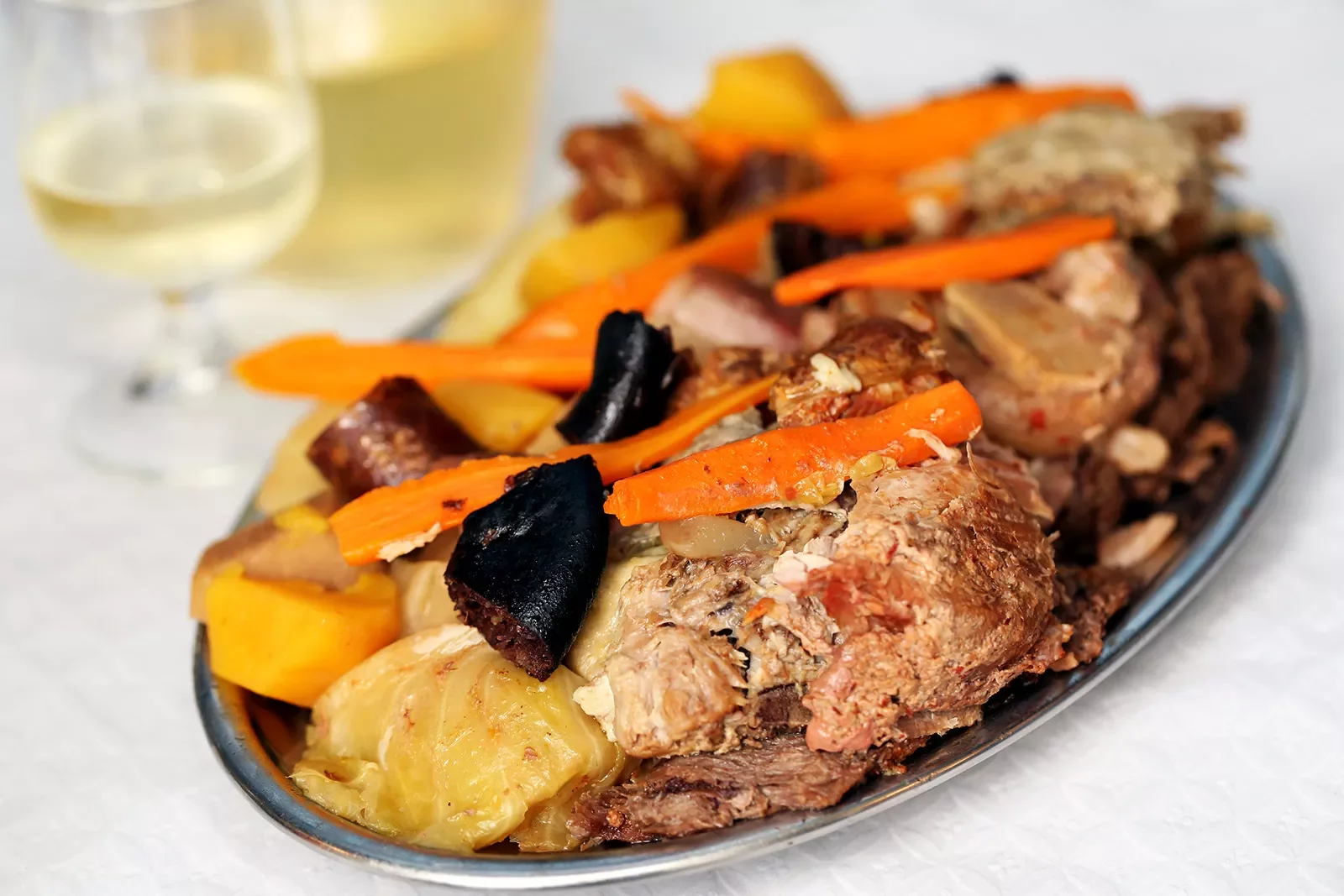 Traditional Portuguese dishes, the Azores, the region Furnas .Switch in restaurants, cooked in boilers The various types of meat and cabbage with potatoes and carrots.