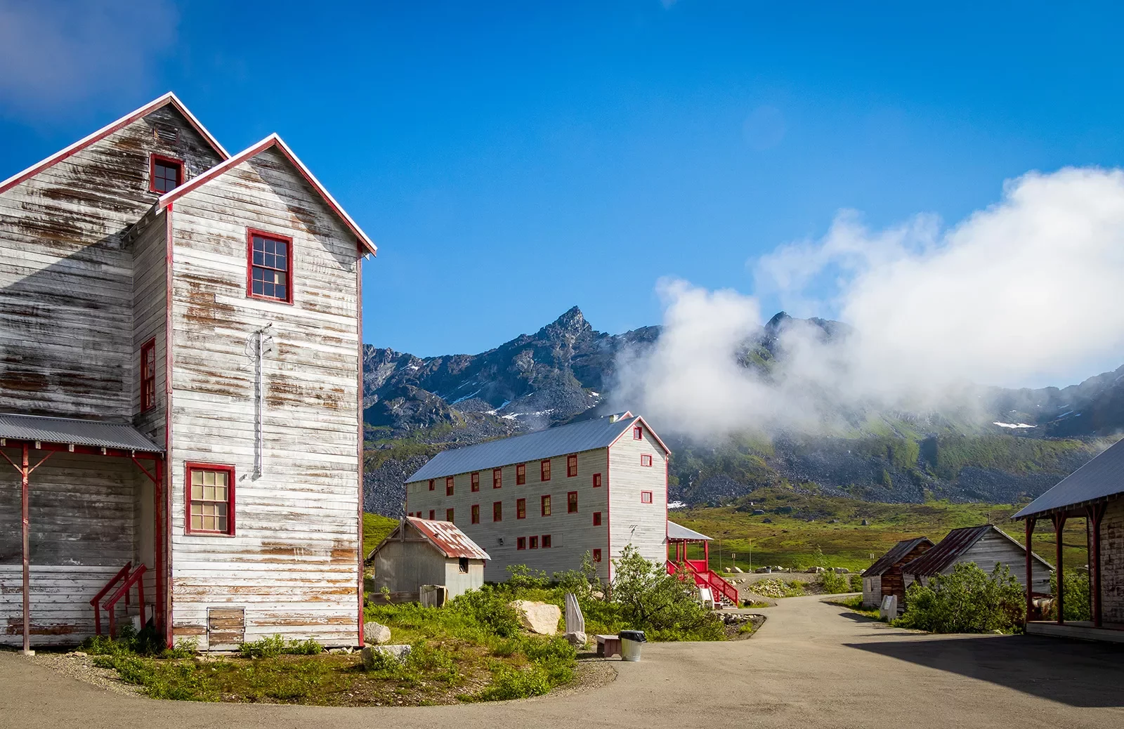 Wood sided buildings next to a mountain in Alaska