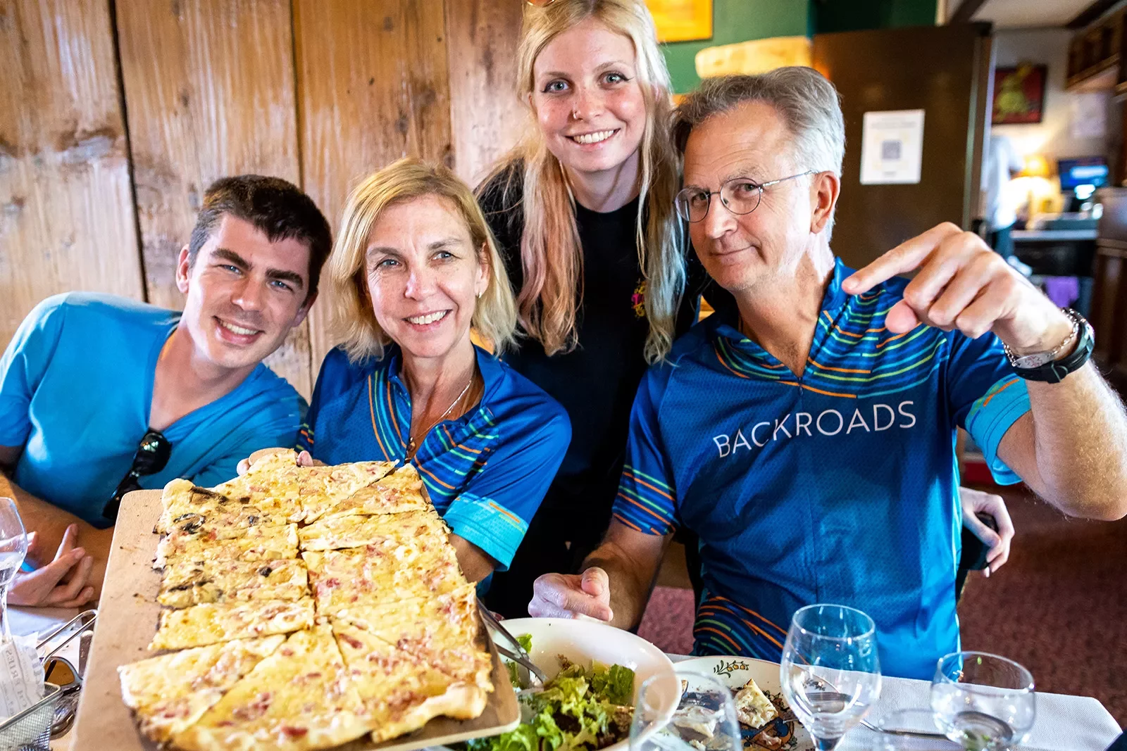 Four Backroads Guests Showing off Food in Alsace